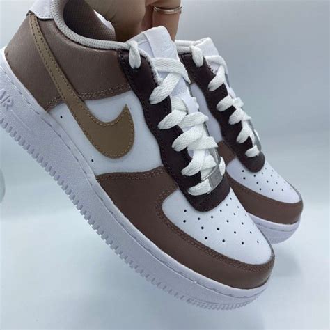 tan and white Nike's